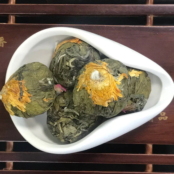 Blooming tea balls with bright pink and orange flowers