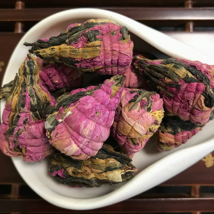 Green blooming tea balls flecked with small flowers